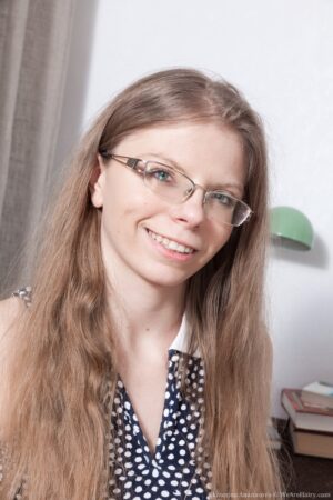 Dirty blonde nerd girl Ekaterina Ananasova fingers her hairy box coyly - EkaterinaAnanasova_BlackPantyWoodDesk_004