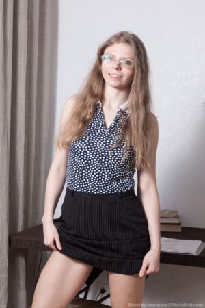 Dirty blonde nerd girl Ekaterina Ananasova fingers her hairy box coyly - EkaterinaAnanasova_BlackPantyWoodDesk_009