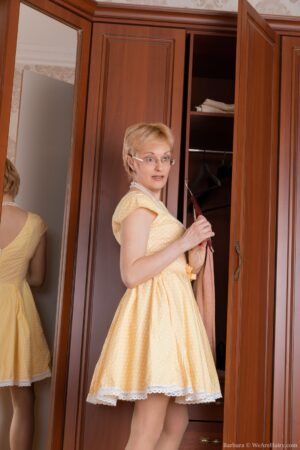 Bespectacled mature blonde Barbara looking hot and hairy in stockings