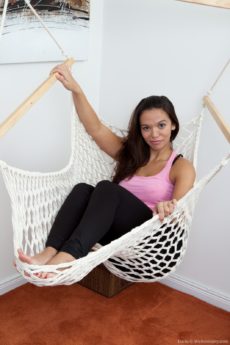 Hairy girl Lucie lounges in her hammock