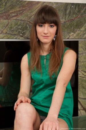 Hairy Natasha spreads her long legs