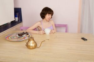 Miki sips her tea and spreads her legs