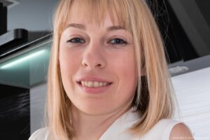 Cute blonde lass Natinella hikes her skirt to show her furry mound