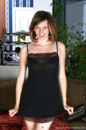 Lithe brunette Sasha slips a finger in her furry pussy