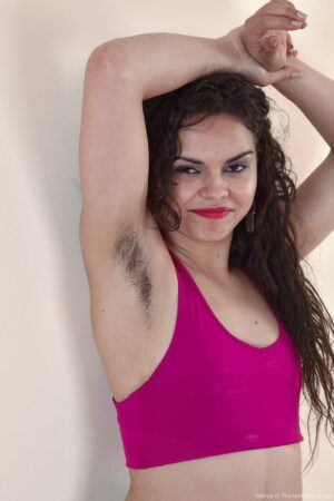 Exotic curly haired brunette Sierra is working out until she gets horny and naked to reveal her full bush