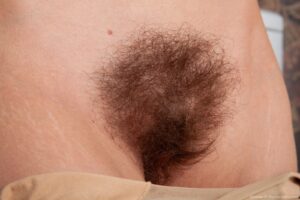 Simone shows off her hairy armpits and big furry pussy lips - simone-has-naked-fun-by-her-laundry-machine8
